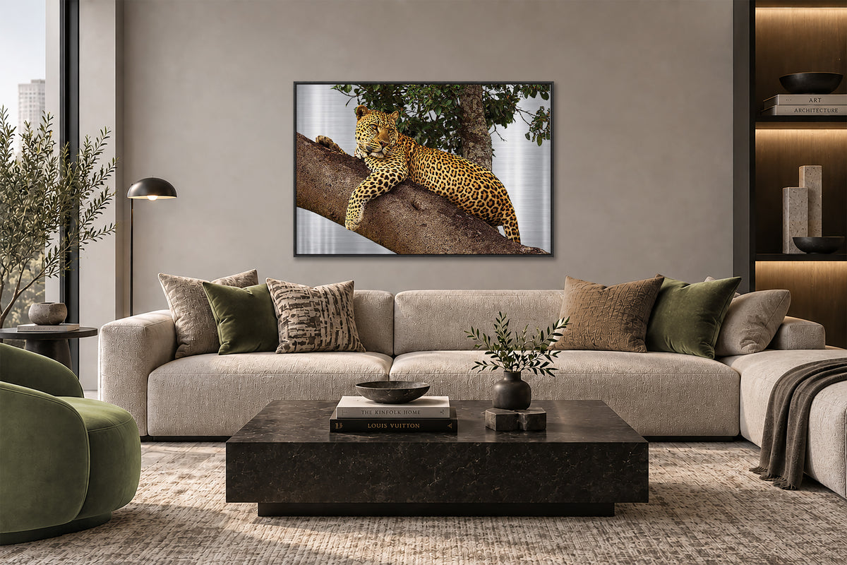 a large framed photograph of a leopard resting on a tree branch in a living room setting.