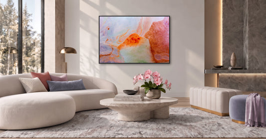 Abstract metal wall art in blush lavender coral orange and pale blue with organic fluid patterns and black floater frame