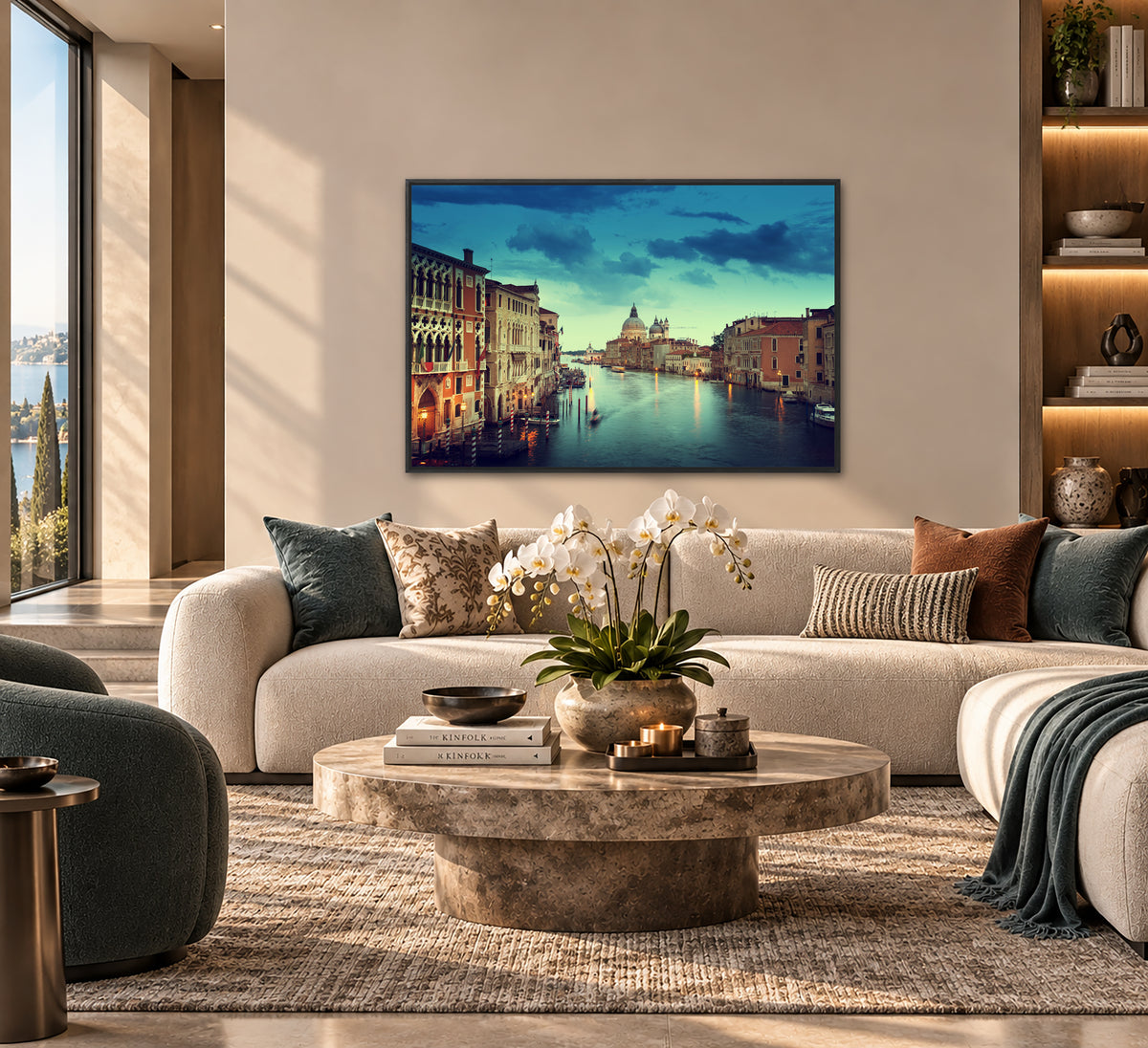 a modern living room with a large window overlooking a picturesque cityscape. The room is furnished with a white sofa, a round coffee table, and a bookshelf. A large framed picture of a city skyline hangs on the wall, adding a touch of elegance and sophistication to the space.