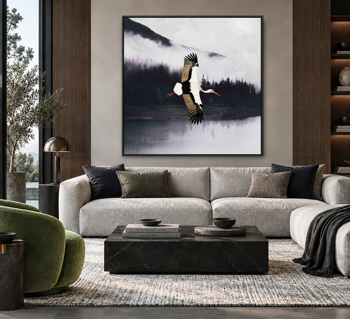 a large framed painting of a bird in flight above a sofa in a modern living room setting.