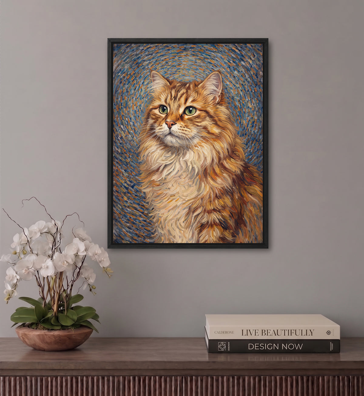a framed painting of a fluffy orange cat with a blue and white background, hanging on a wall above a wooden shelf with a potted plant and a stack of books.