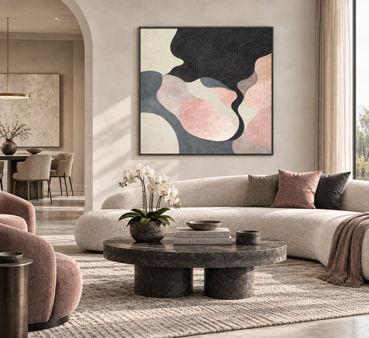 a modern and stylish living room with a large abstract painting on the wall, a round coffee table with a vase of white flowers, a plush white sofa, and a large window overlooking the outdoors.