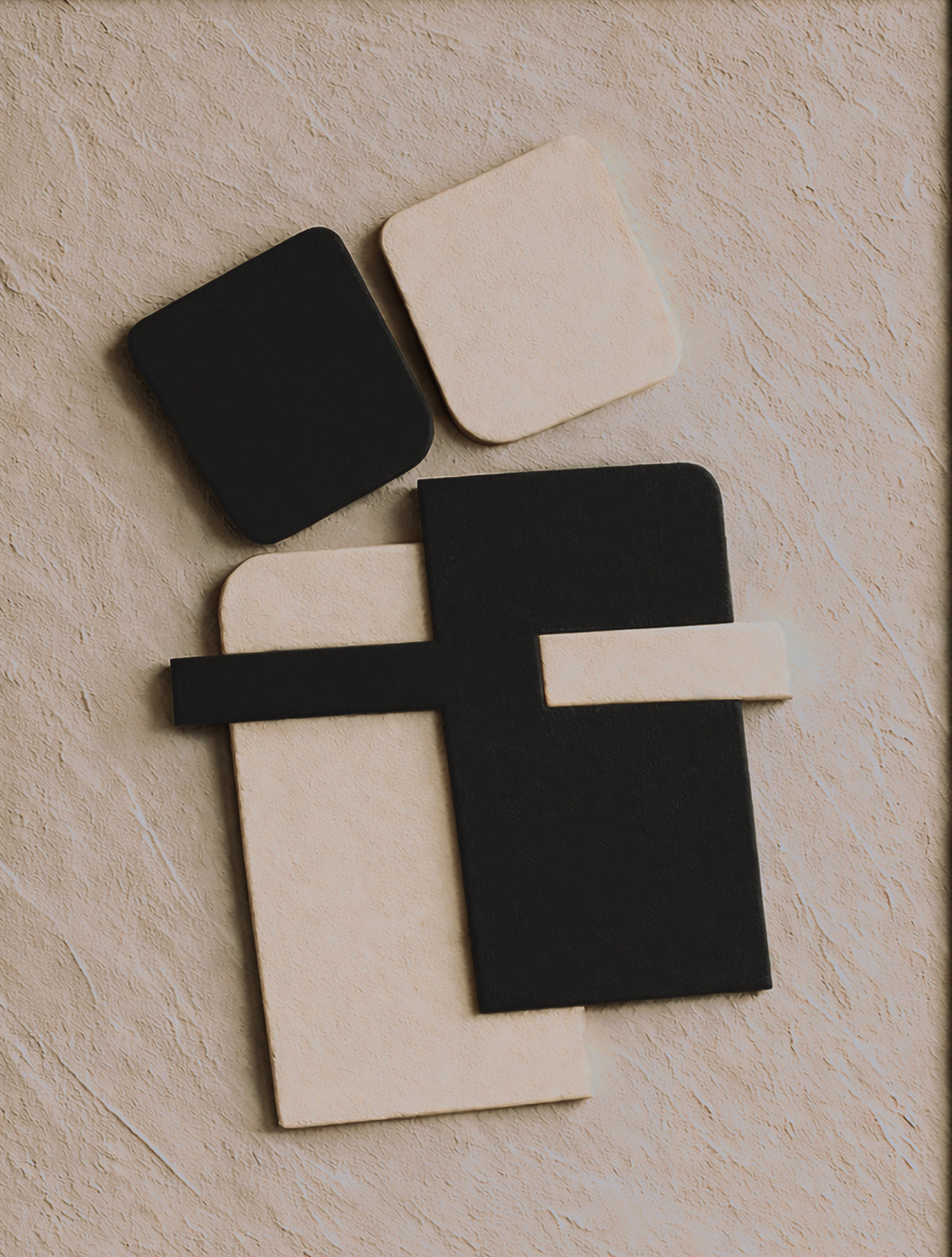 a collection of abstract shapes and forms, including a black square, a white square, and a black rectangle, arranged on a textured surface.